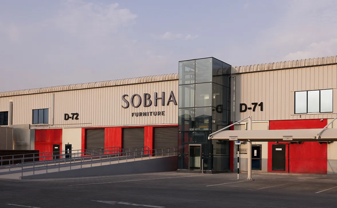 Exterior of Sobha’s flexible manufacturing facility in Abu Dhabi with a modern glass façade